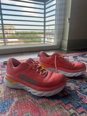 Hoka Bondi Coral-Pink Running Shoes with Yellow and White Accents